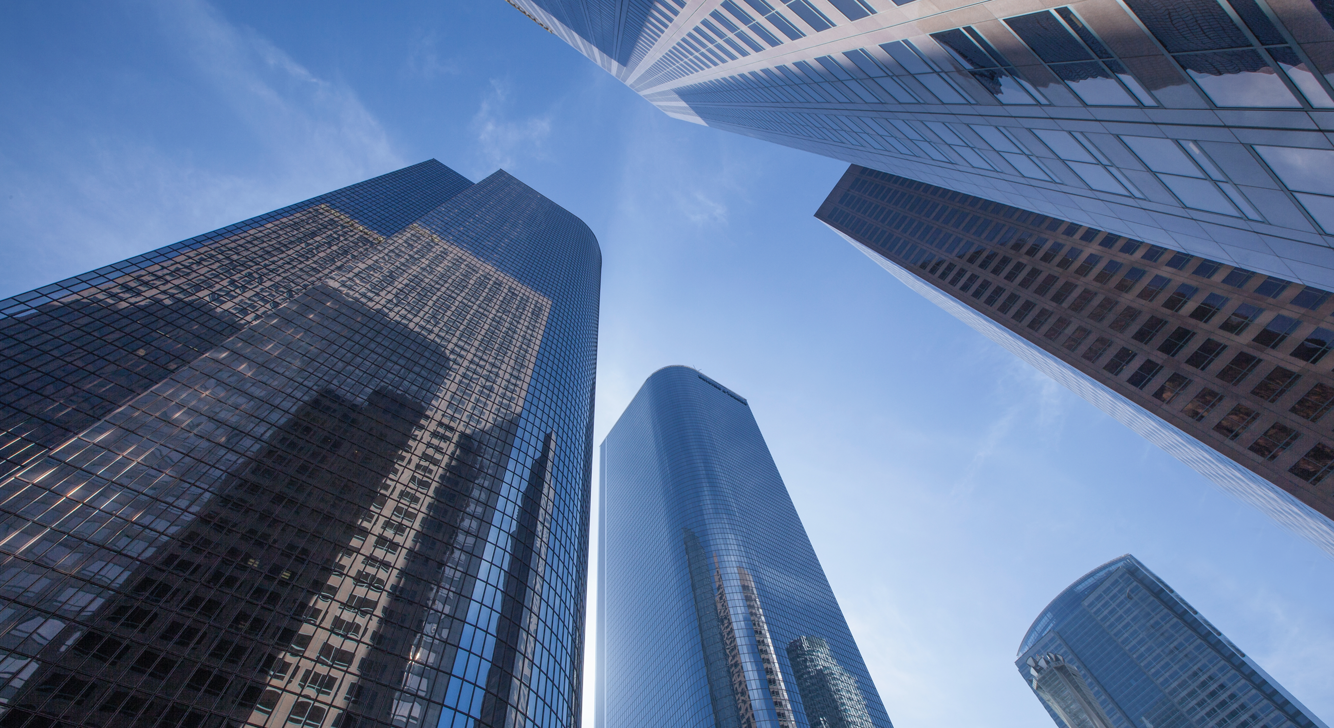 tall building in a city looking from below